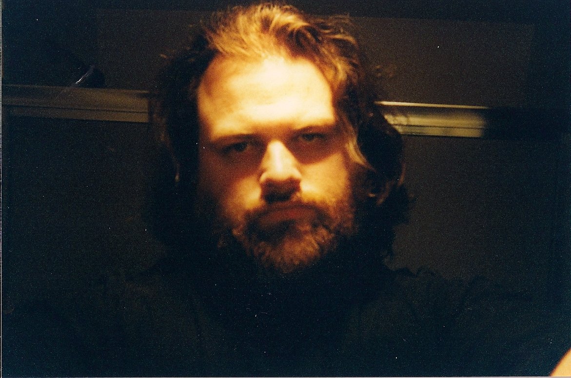 Young man with nothing better to do than take pictures of himself.